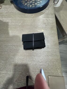 Compact Black Foldover Wallet with Wrap Strap